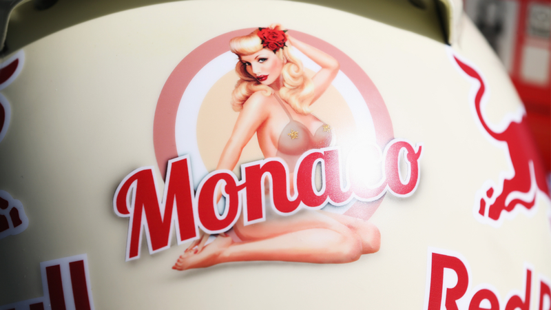 Illustration for article titled Sebastian Vettel's Monaco Helmet Reveals A Naked Pinup When Heated